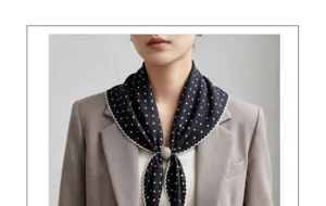 Retro polka dot triangular scarf with elegant scalloped edge and charming beaded ring accent.