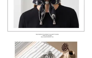 Detail view of vintage printed triangular head scarf with beaded tassels and snow bud edge.