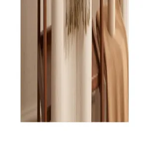 Close-up detail shot of the soft winter scarf showcasing fine tassel trim and elegant fabric.