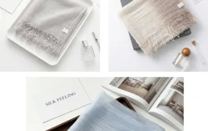 Close-up details of the luxurious mulberry silk scarf with delicate tassels in lifestyle flat lay.