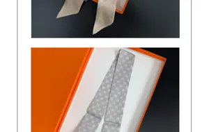 French twill narrow silk scarf with lovely heart print presented in an elegant orange gift box.