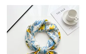 Chic imitation silk square scarf featuring vibrant lemon print and elegant blue baroque design.