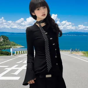 Black long sleeve top with polka dot narrow scarf, elegant and versatile daily wear style.