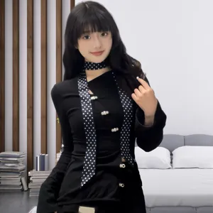 Black polka dot narrow scarf versatile neck accessory lightweight elegant seasonal fashion piece.