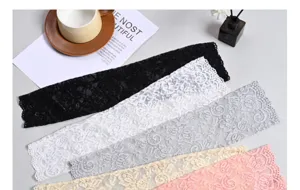 Detailed view of lace sun protection sleeves, multi-color delicate floral summer arm covers.