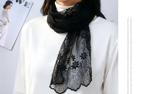 Detailed view of the elegant black lace floral embroidered scarf showing exquisite craftsmanship.