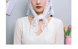 White lace embroidered triangular scarf for women, retro style vintage floral headscarf detail.