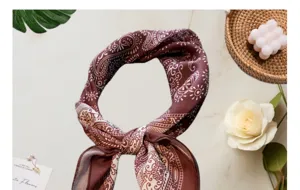 Close-up detail of the retro brown paisley cotton linen square scarf and head wrap.