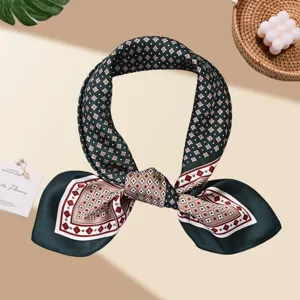 Elegant dark green silk scarf featuring retro geometric diamond pattern detail display.