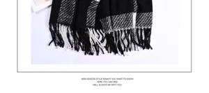 Black and white plaid scarf detail showing classic pattern and soft tassel fringe edge.