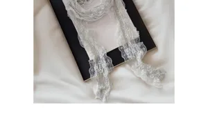 Delicate white lace ribbon detail, sweet pleated long decorative waist belt and versatile neck scarf.