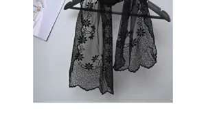 Black lace embroidery scarf detail, elegant floral pattern shawl, lightweight sheer neckerchief.