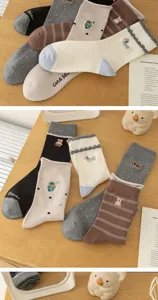Detailed view of cute cartoon embroidered cotton mid-tube socks with cozy textures and sweet styles.