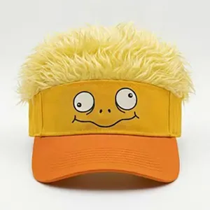 Close-up detail of funny yellow wig visor cap with googly duck face and orange brim.