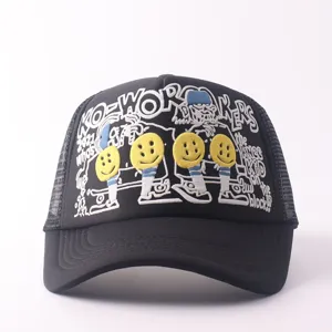Close-up view of black trucker cap featuring detailed embroidery, smiley faces, and mesh.