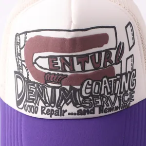 Detailed view of the stylish trucker hat with unique graphic print and mesh back design.