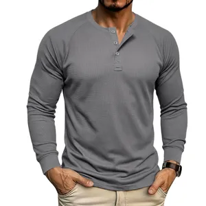 Men's waffle knit long sleeve Henley shirt featuring front buttons and textured fabric.