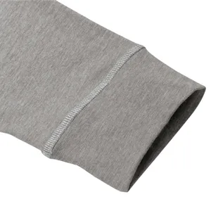 Grey long sleeve t-shirt apparel cuff detail showing fine stitching and soft fabric texture.