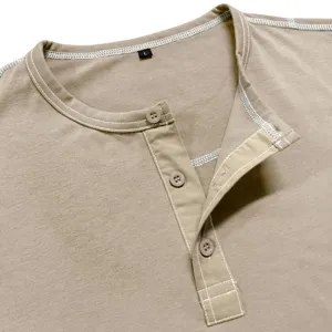 Detail view of men's khaki henley shirt collar, buttons and white contrast stitching.