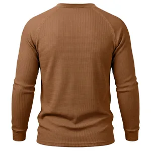 Back view detail of brown waffle knit long sleeve thermal shirt showing fabric texture.