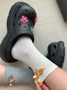 Cute 3D cat mid-tube socks with chunky black clogs, playful design for women and girls daily wear.