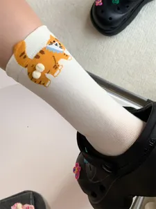 Cute funny 3D cat mid-calf socks for women, quirky orange cat design with fluffy pom pom.