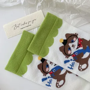 Cute cartoon animal pattern cotton socks with green wave cuff, detail view of cozy cat socks.