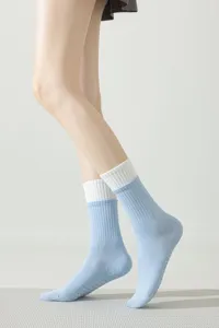 Professional non-slip yoga socks for women, pilates grip socks with breathable cuff.