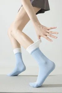 Detail view of women's anti-slip yoga socks with ribbed cuffs, ideal for pilates and fitness.