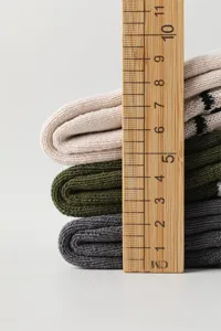 Detailed view of men's cotton mid-tube striped winter thermal socks with looped sole.