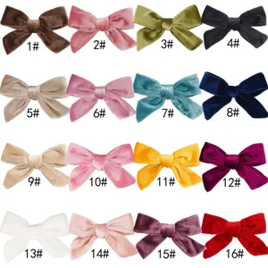 Collection of 16 colorful velvet bow hair clips for girls' autumn winter accessories.