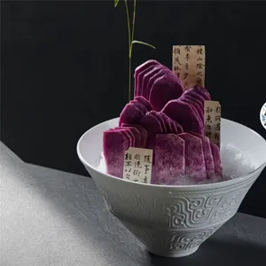 Elegant close-up of premium sashimi platter decoration with purple yam slices on ice