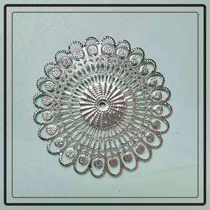 Intricate silver filigree decorative plate for gourmet sashimi platter presentation