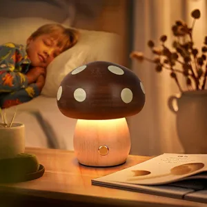 Close-up of a warm wooden mushroom night light in a cozy bedroom setting