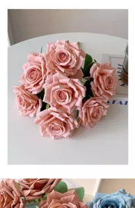 Close-up of realistic dusty pink artificial roses with delicate petal textures