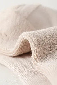 Men's breathable cotton sock detail shot showing soft loop towel sole texture and fine weave.