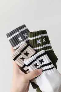 Men striped embroidered mid-calf cotton sports socks with breathable loop cushion bottom.