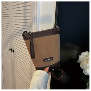 Brown canvas leather crossbody phone bag, minimalist shoulder bag, chic autumn fashion accessory.