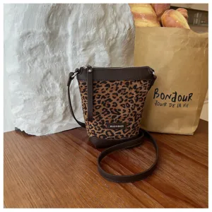 Stylish leopard print crossbody shoulder bag for women, compact phone bag with chic brown trim.