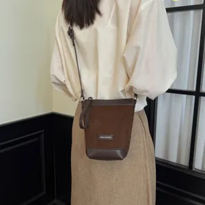 Brown suede crossbody bag for women, stylish minimalist shoulder bag with fine strap for daily use.