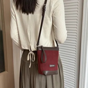 Detailed view of autumn new women small crossbody bag, chic contrast color phone shoulder bag.