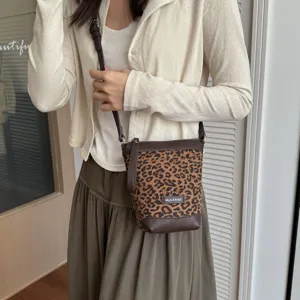 Leopard print small crossbody phone bag detail view, chic casual daily shoulder handbag.