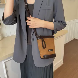 Stylish brown crossbody phone bag for women, chic small shoulder bag for daily casual outfits.