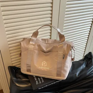 Casual women travel duffel bag, portable handbag and shoulder bag for sports and fitness.