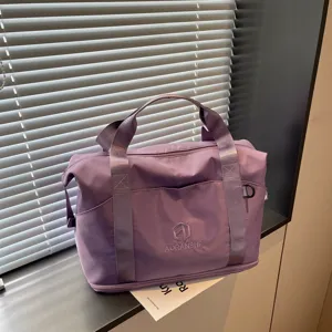 Purple travel bag for women, portable gym duffel bag, casual shoulder bag for sports and swimming.