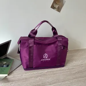 Purple travel duffel bag for women, portable fitness sports bag with shoulder strap.