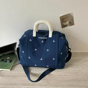 Bolso de viaje azul oscuro con bordado de lazos blancos, gran bolsa deportiva.