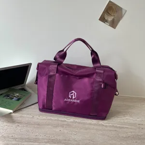 Detailed view of the purple travel duffel bag showing durable fabric, sturdy handles and zipper.