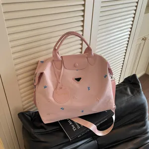 Roze grote reizen tote tas voor vrouwen met schattige strik borduurwerk voor pendelen