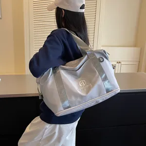 Large capacity travel duffel bag for women, waterproof gym sport tote with shoulder strap.